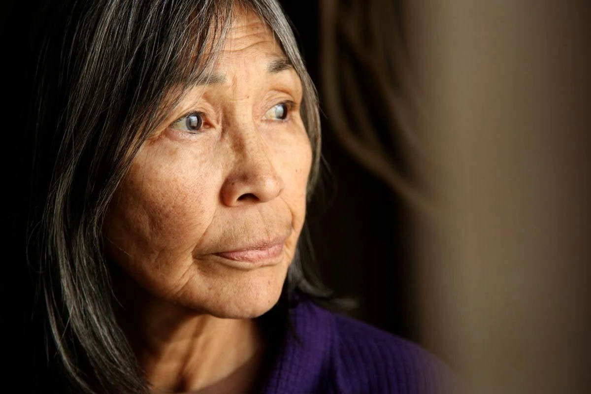 An older woman looking off into the distance